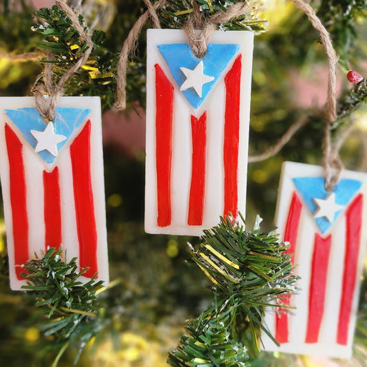 Wax Ornaments with Puerto Rican flag design hanging on a Christmas tree.