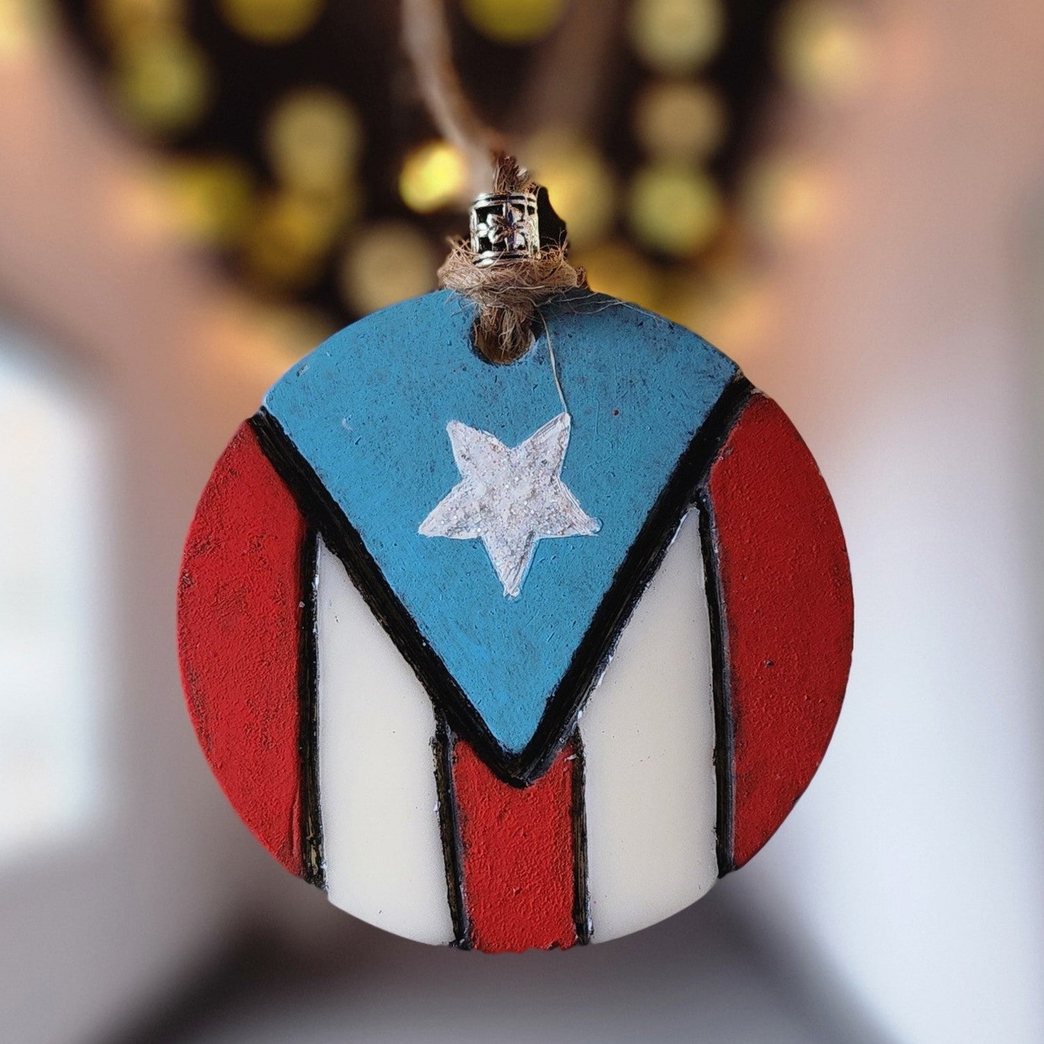 Decorative ornament with red, white, and blue design on a blurred background. Puerto Rico Flag