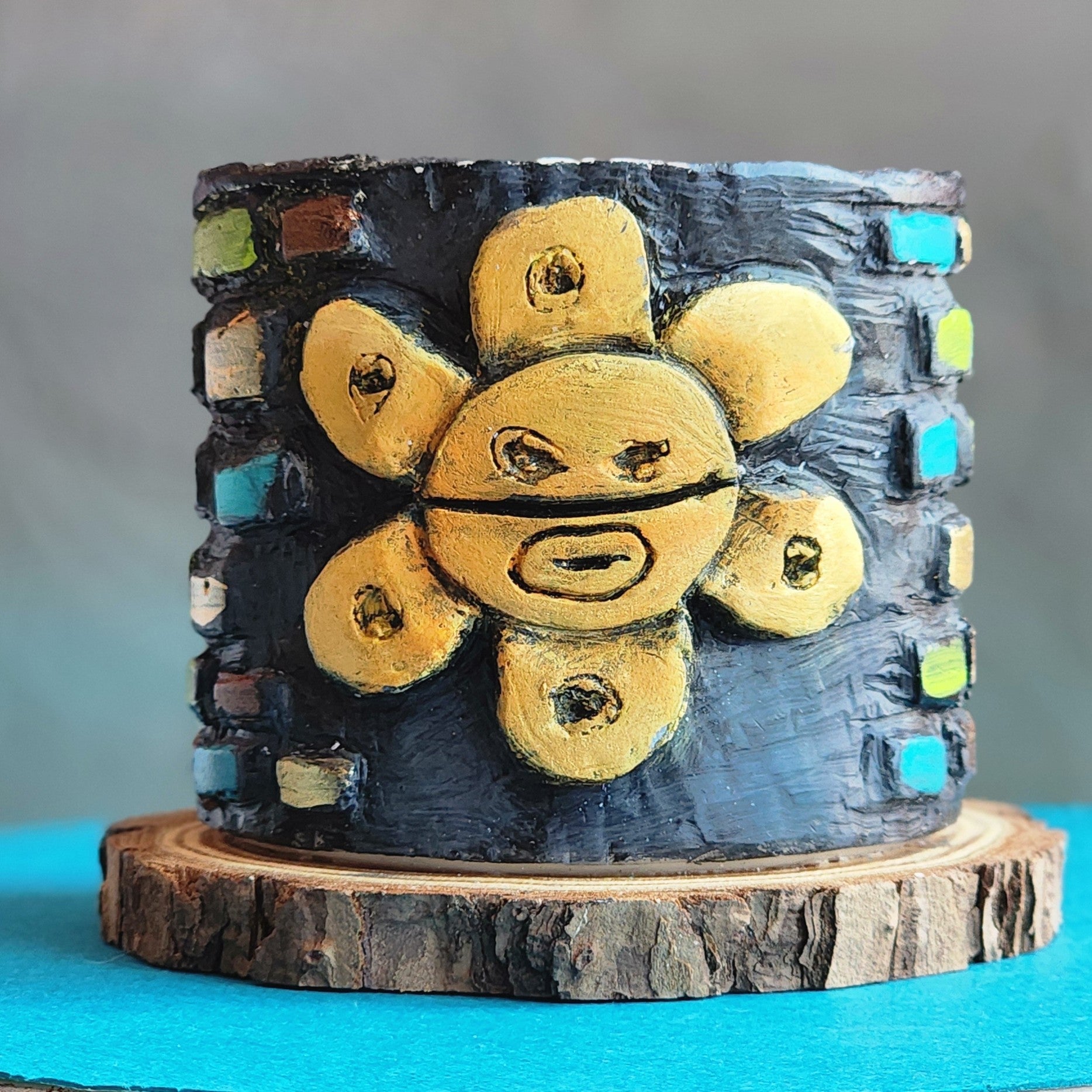 Decorative piece with yellow circular elements on a gray background