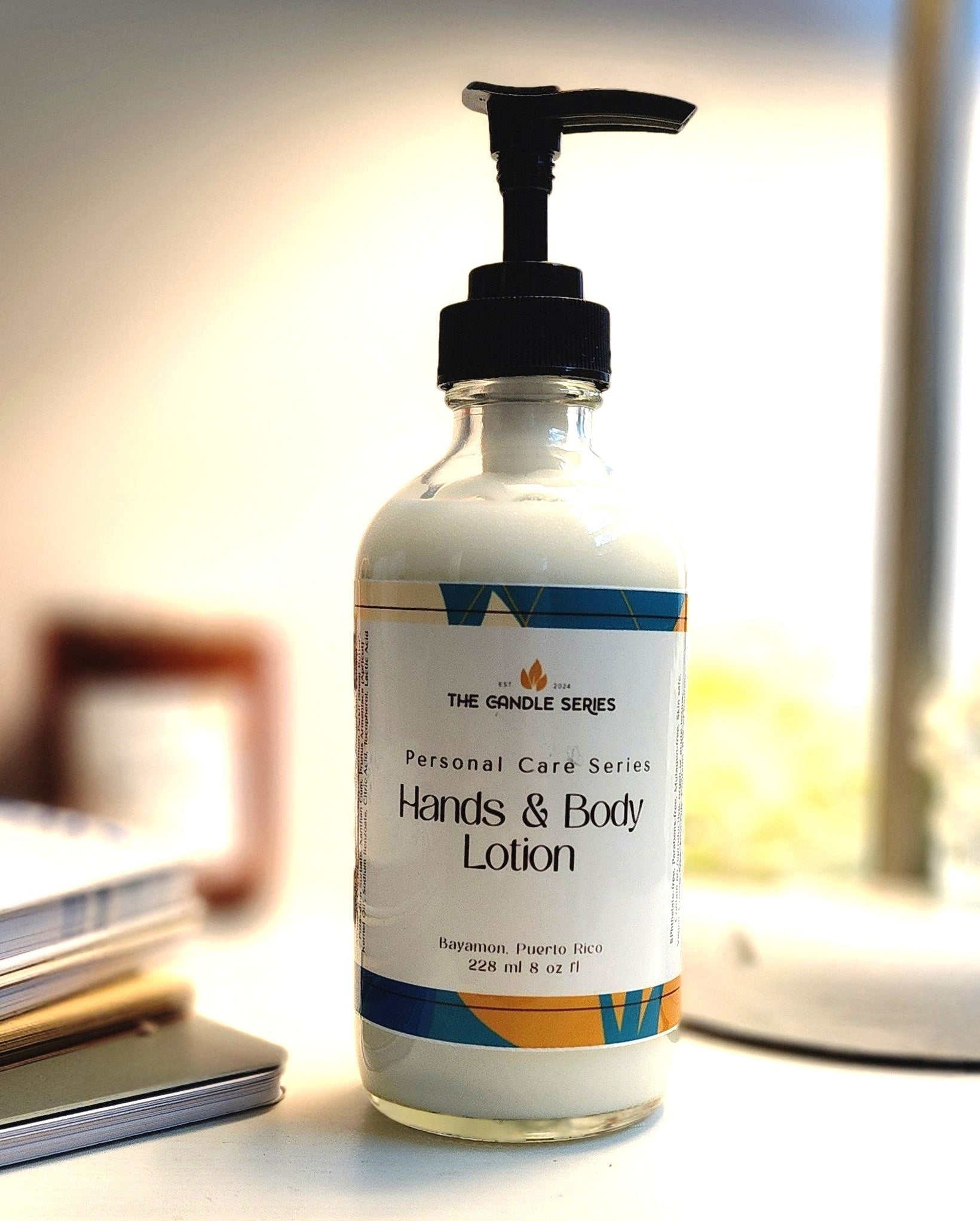 Bottle of hands and body lotion on a desk with a blurred background